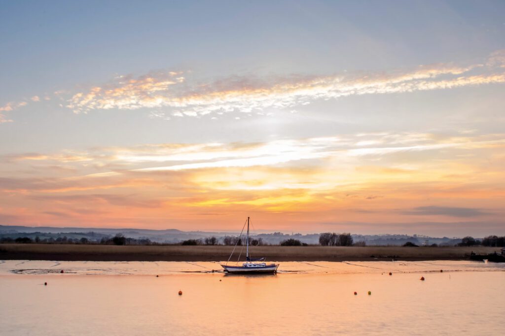 Boat on river in sunset