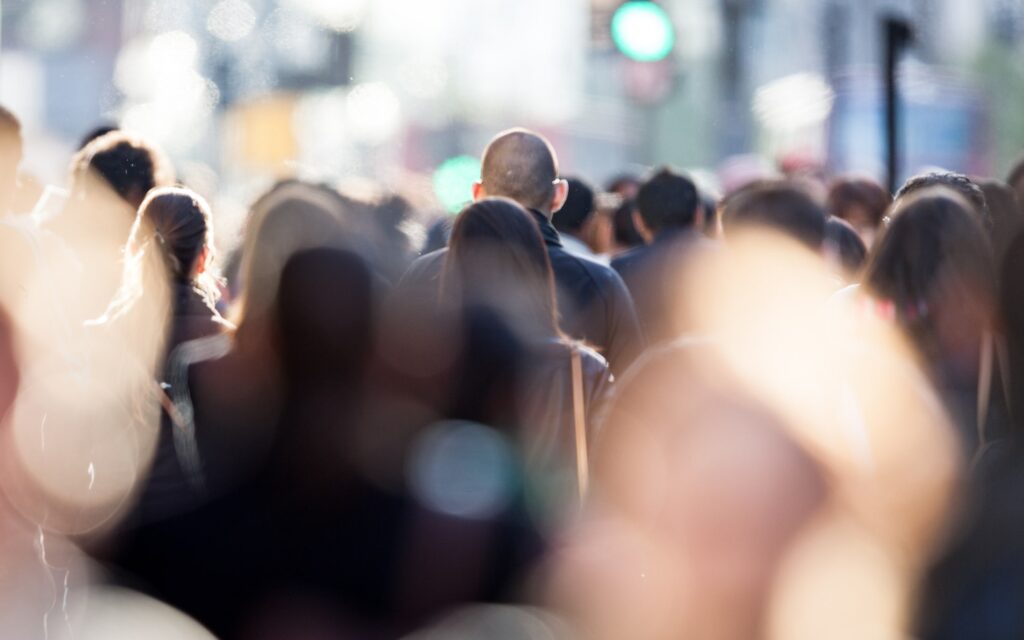 Large group of people walking street