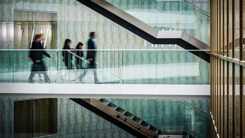 People walking on building bridge