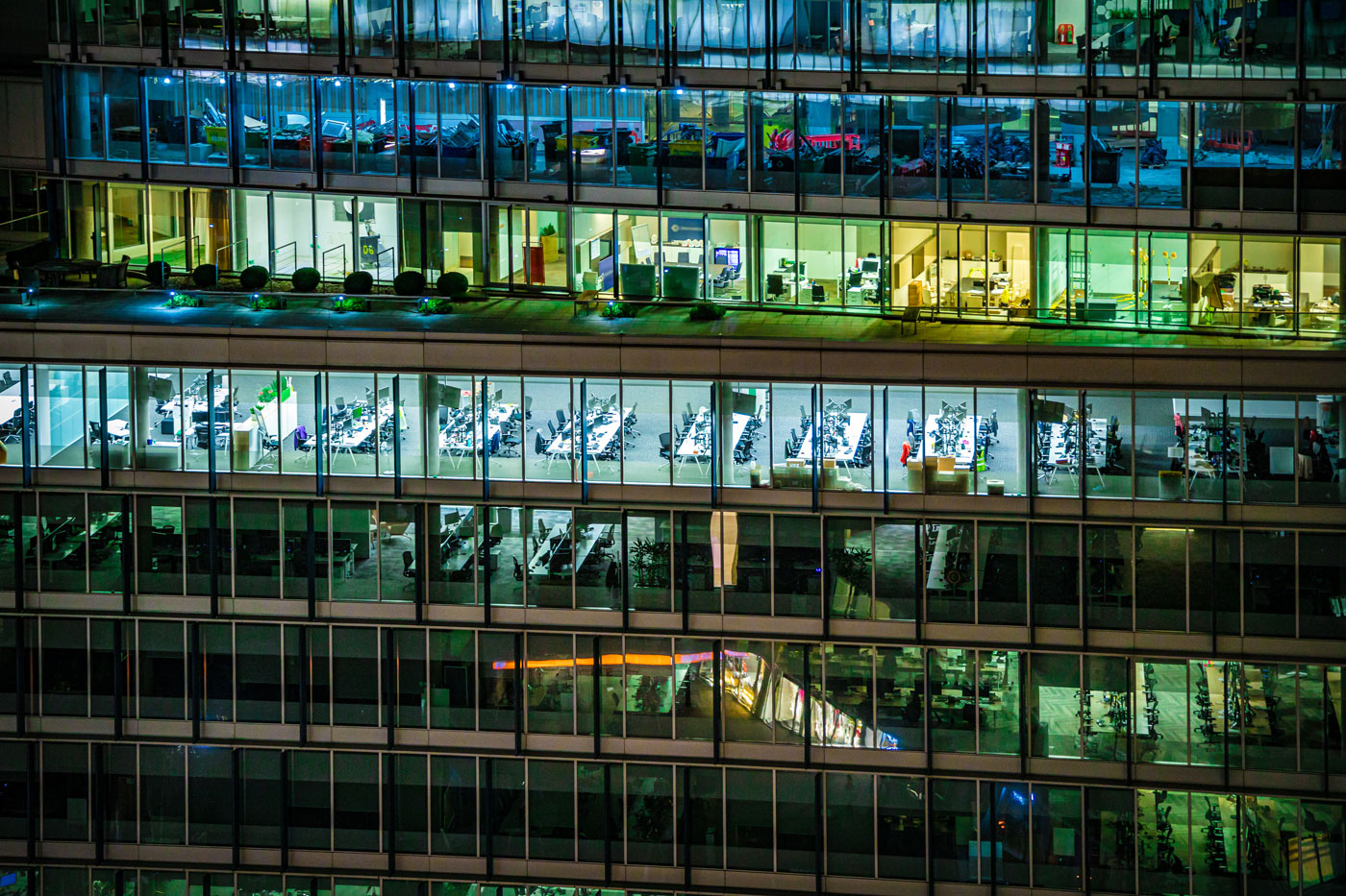 Close up of highly detailed and illuminated modern offices during night hours