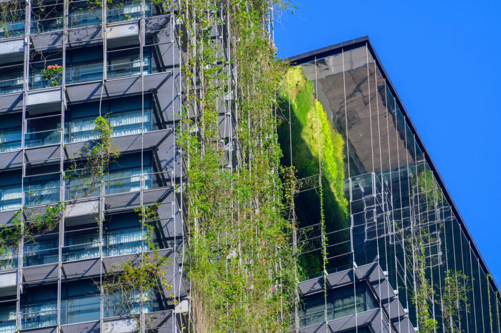 Futuristic buildings with vines hanging down