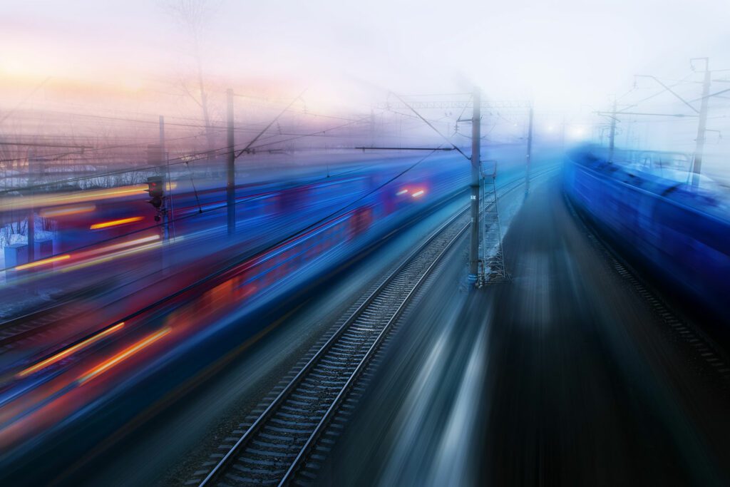 movement of trains in ways of evening twilight fog spring