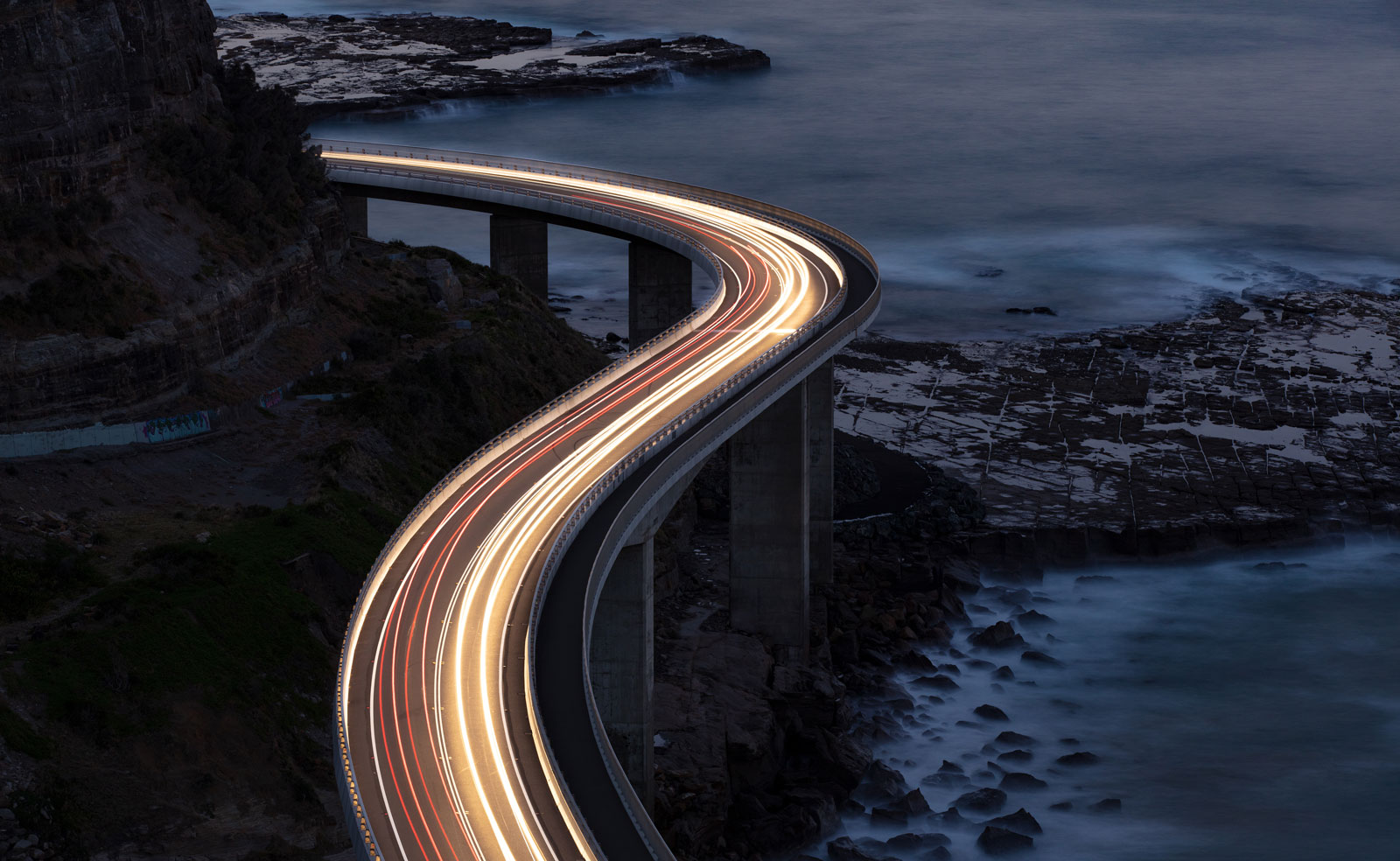 Car light trails on Sea Cliff Bridge
