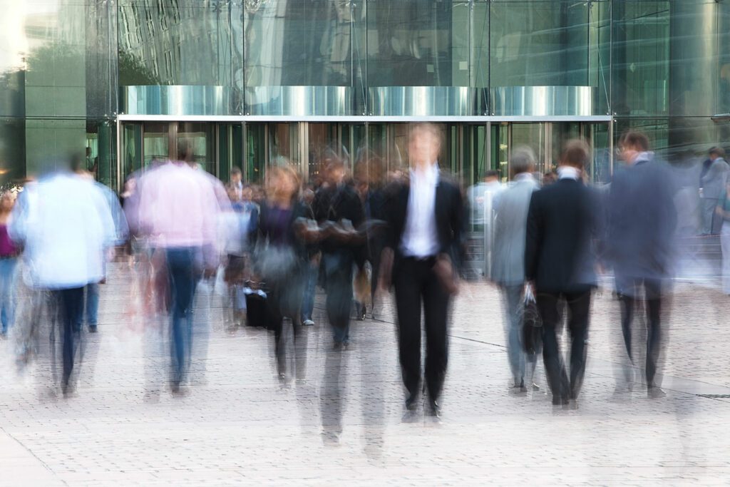 Business people walking in front of an office building