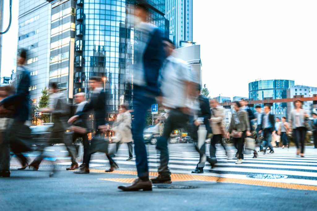 Blurred group of business people commuting on the streets