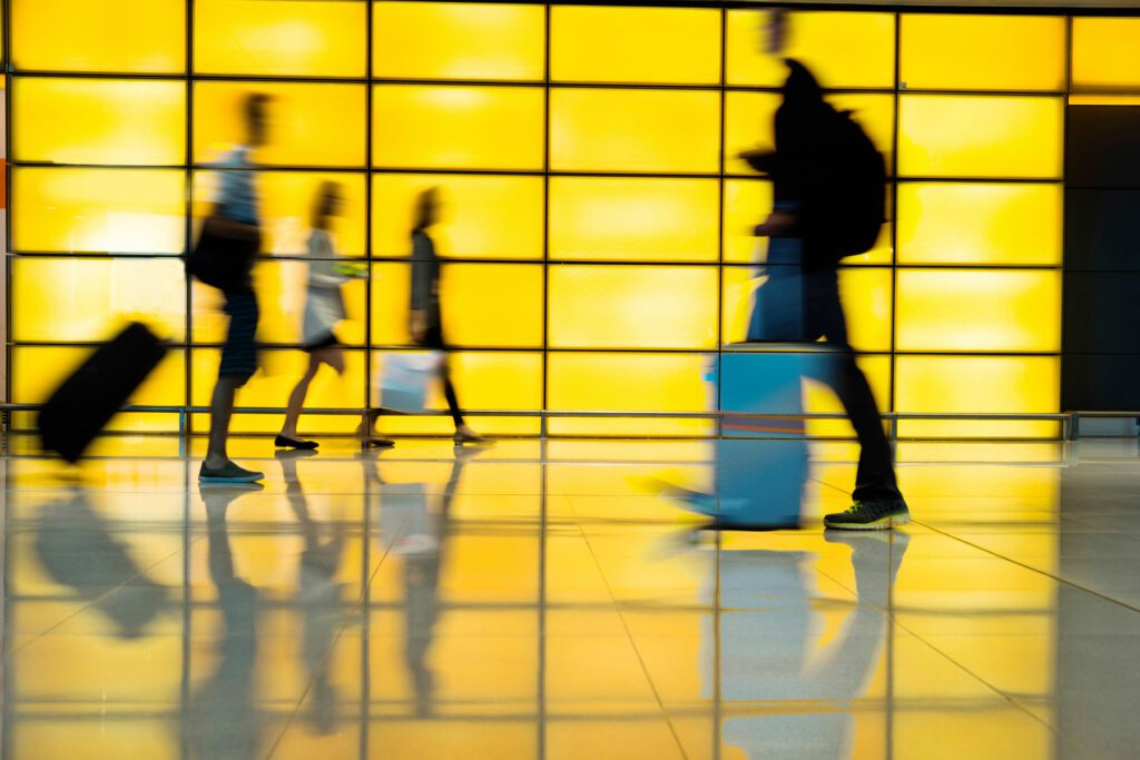 Passengers walking in modern corridor