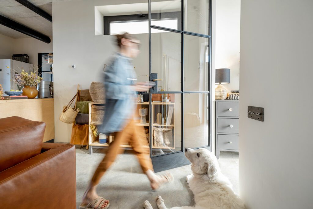 Living room in scandinavian natural style with female and dog indoors