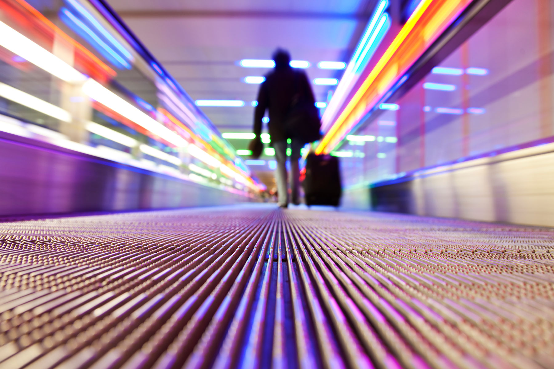 Person traveling with visa on flat escalator