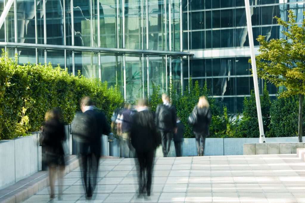 Business People Walking in Financial District, Blurred Motion