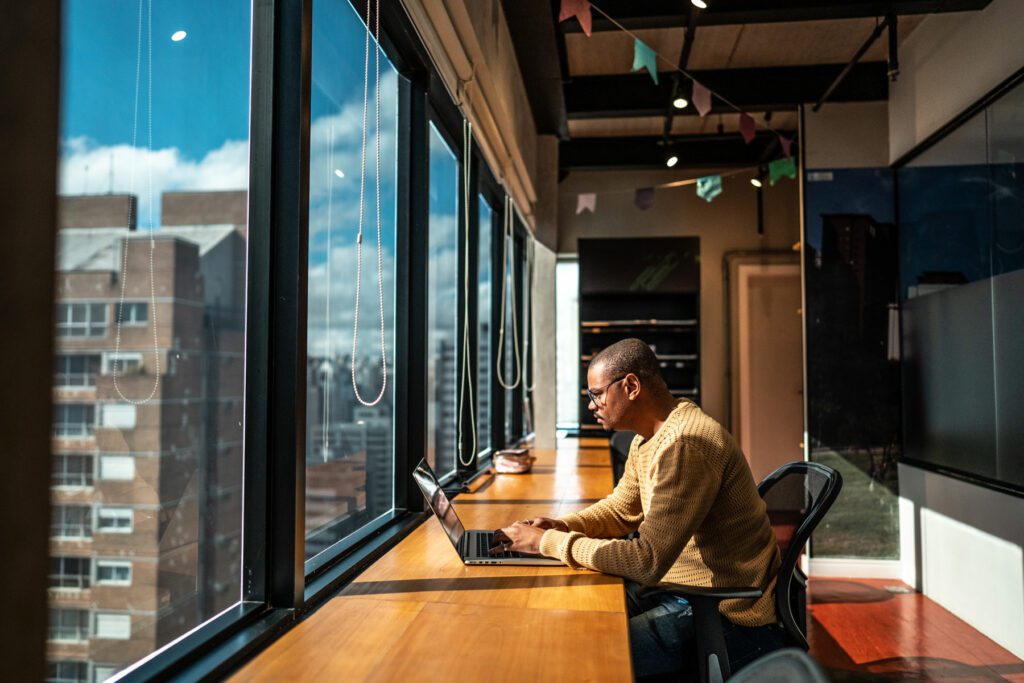 Adult man working using laptop at office