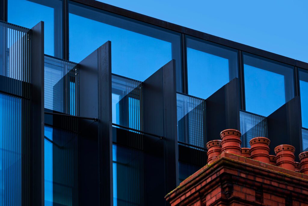 Data and Block Storage Abstracts. Red chimney near new office building in Dublin.
