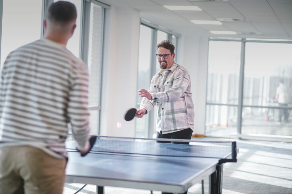 Two people playing table tennis