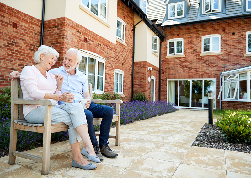 Couple sat outside retirement home