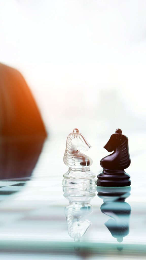 Two knights face to face on the table.