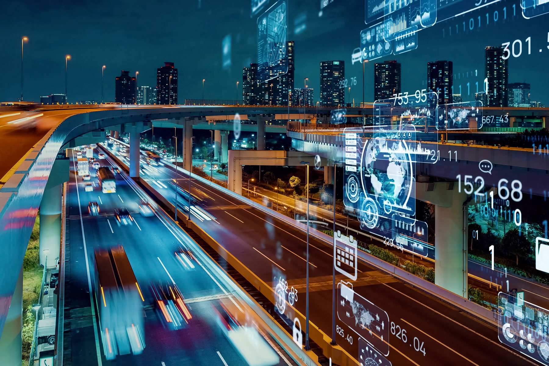 Night-time view of a multi-storey motorway with light trails from moving vehicles, overlaid with glowing digital data visualisations and icons.